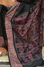 Purvasha Black Bandha saree Odisha folded view — fish border, ikat pallu, Bhulia weavers, Pasapali