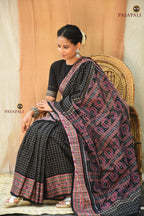 Purvasha Black Sambalpuri Bandha saree motif detail — Bandhakala resist-dye alignment on loom, Pasapali