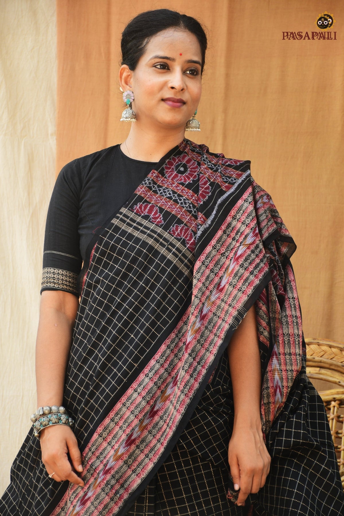 Purvasha GI certified Sambalpuri cotton saree flat lay — full black Bandha weave, jala checks, Pasapali