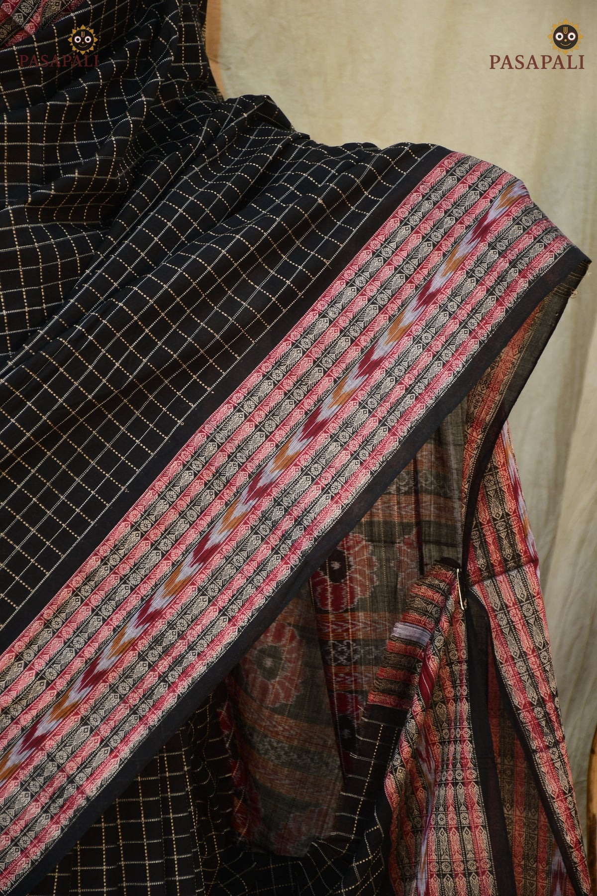 Purvasha Sambalpuri Bandha saree handloom drape — ikat patterns and Daanti body in black mercerized cotton, Pasapali