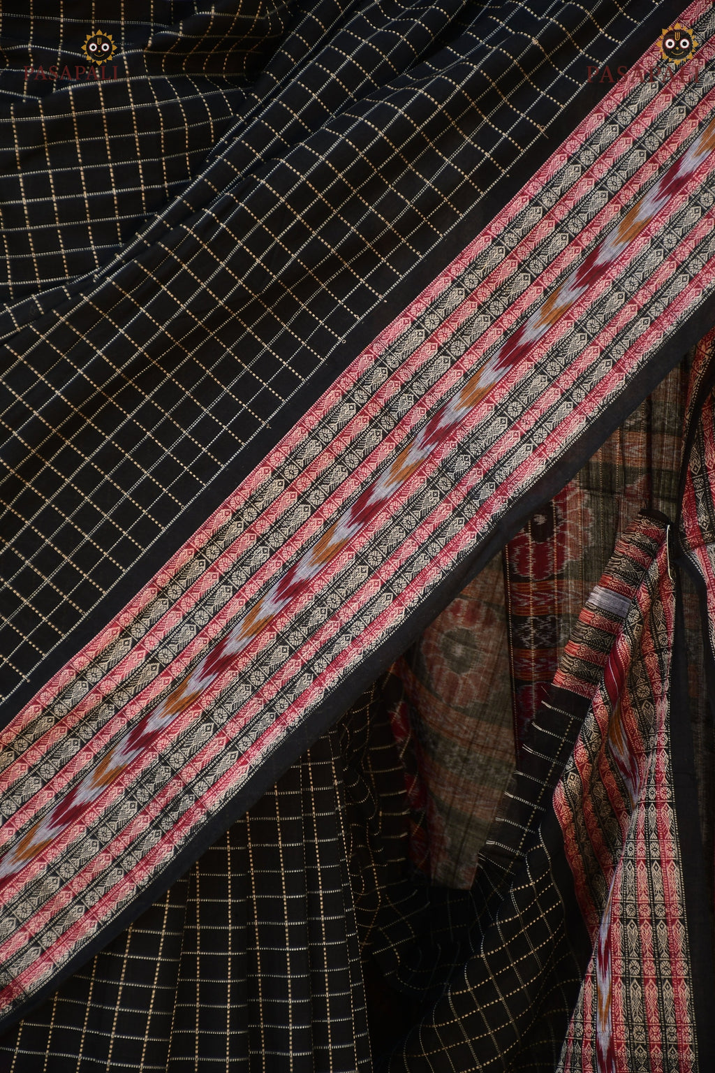 Purvasha Black ikat saree Odisha — Bandha motif detail across warp and weft, Bhulia weavers, Pasapali