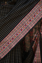 Purvasha Black ikat saree Odisha — Bandha motif detail across warp and weft, Bhulia weavers, Pasapali