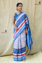 Load image into Gallery viewer, Front drape of Pushpaja Sambalpuri cotton saree — white ground with geometric ikat patterns and blue Rudraksha border | Pasapali
