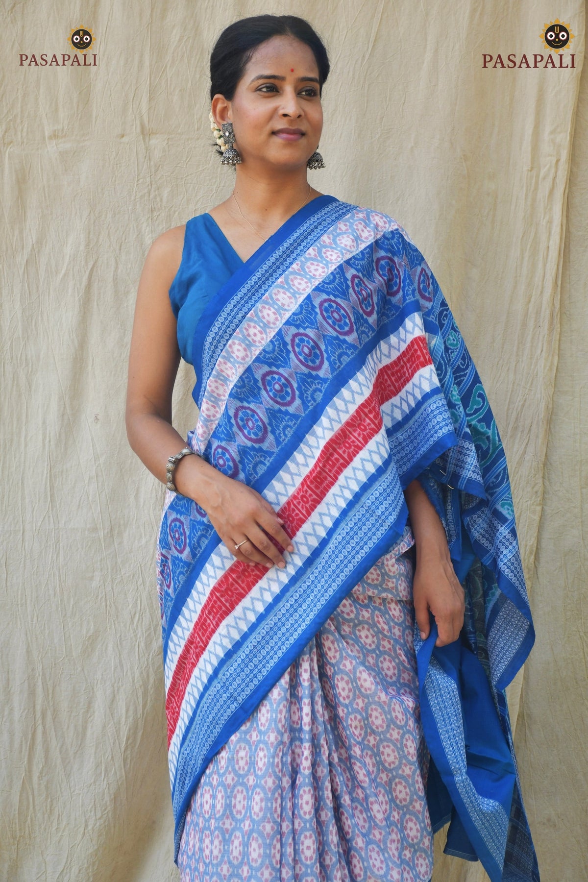 Blue pallu of Pushpaja with traditional floral ikat motifs — GI certified Sambalpuri handloom saree by Pasapali