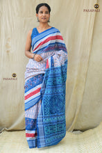 Load image into Gallery viewer, Folded view of Pushpaja Sambalpuri handloom cotton saree showing white body, blue border and pallu colour contrast | Pasapali
