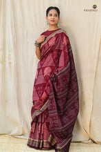 Load image into Gallery viewer, Flat lay of Ramā Goddess Laxmi Inspired maroon Sambalpuri Bandha saree — full length 5.40m, Pasapali GI certified handloom
