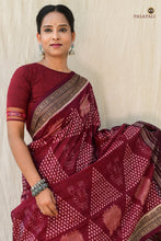 Load image into Gallery viewer, Handloom drape view of Ramā Sambalpuri Bandha saree in maroon — Lakshmi motifs visible on pallu and body, Pasapali
