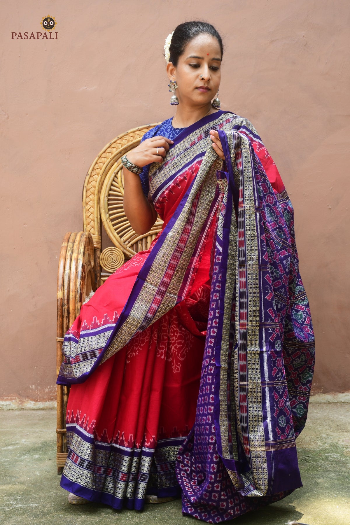 Ratnaprabha Sambalpuri cotton saree front drape — red and blue double ikat with rudraksha phula buta border visible
