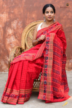 Sachipar Daanti draped front — red Sambalpuri Bandha saree, flower buta border, chevron pallu, Pasapali