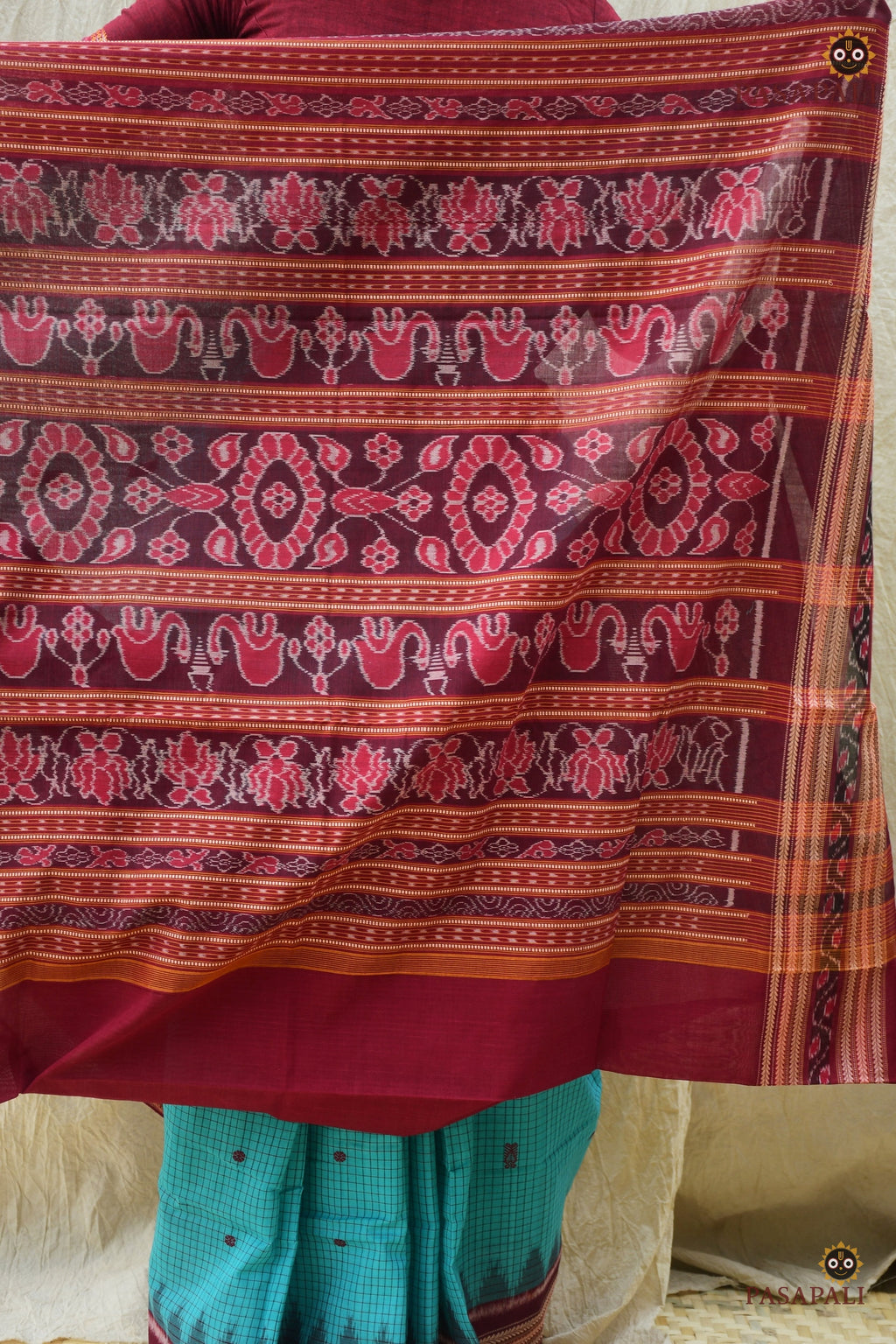 Front drape detail of Sachipar GI certified Sambalpuri cotton saree in Rama Green showing pallu fall by Pasapali