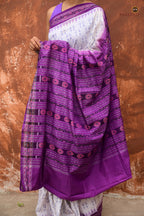 Shabari Sambalpuri handloom saree overhead view — white and purple Bandha ikat, Pasapali, Odisha