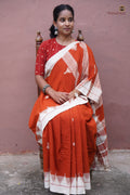 Shalmali Kotpad saree front drape — orange natural dyed cotton with macha pharsa body motifs, Pasapali