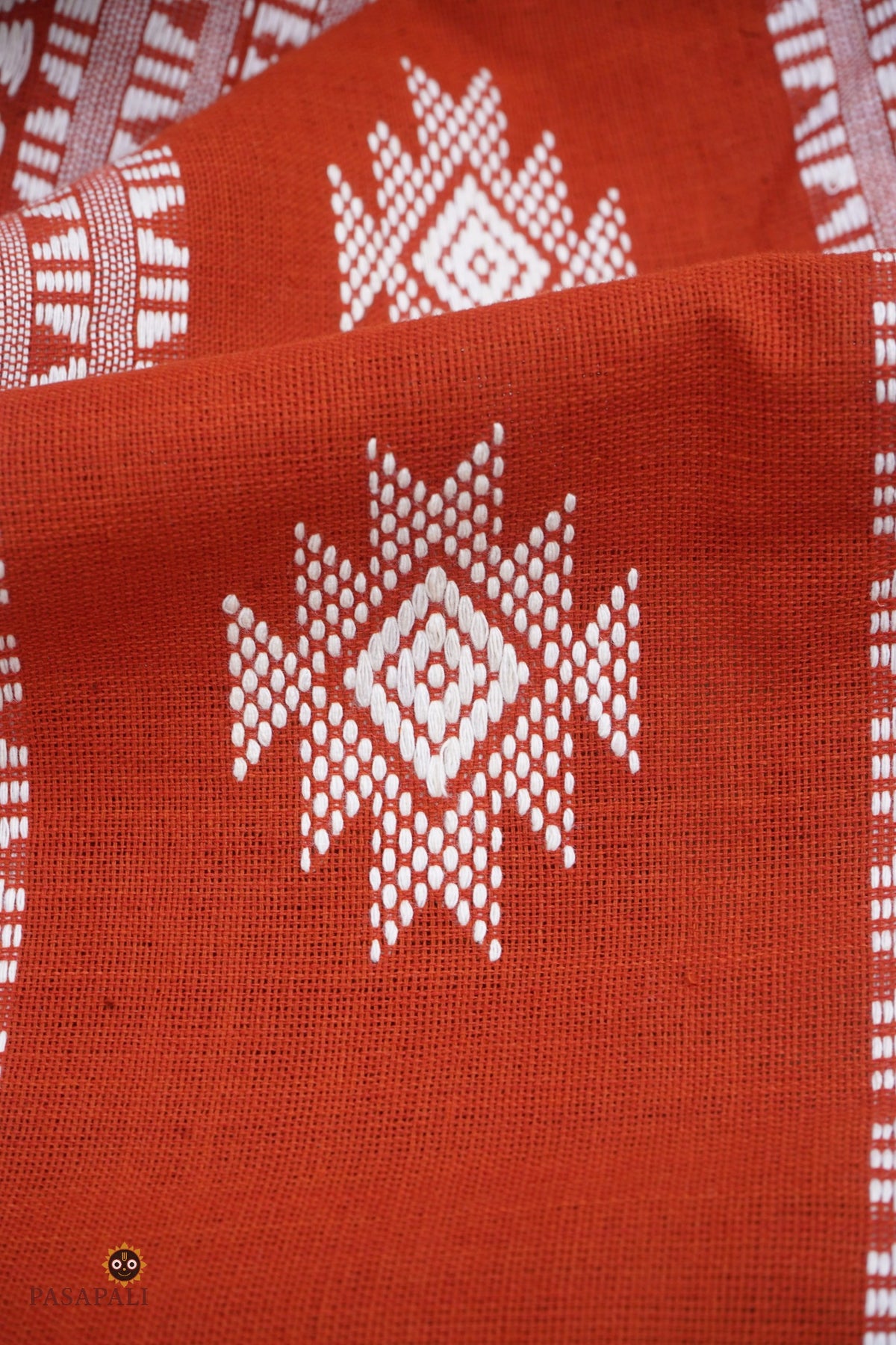 Shalmali Kotpad natural dye saree folded — orange and off-white cotton, Pasapali handloom