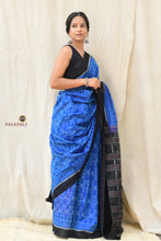 Load image into Gallery viewer, Close-up of plain solid black border on Shankhamayi Sambalpuri Bandha mercerized cotton saree by Pasapali
