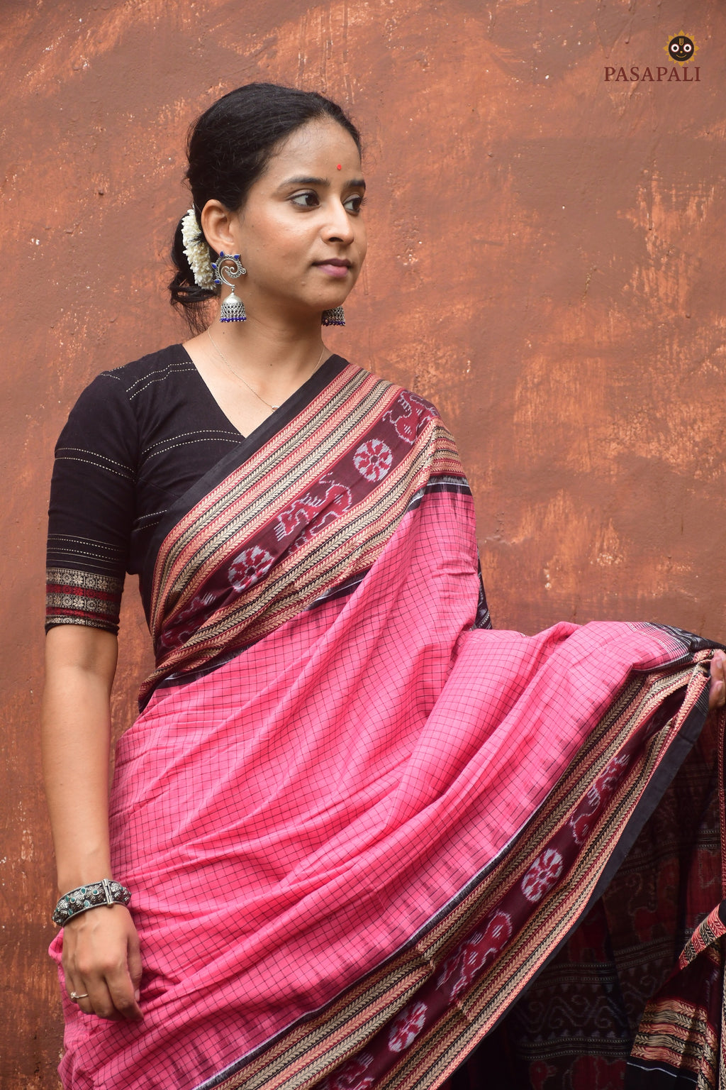Handloom drape view of Sharada — pink Sambalpuri Bandha saree with sachipar checks and khajur border by Pasapali
