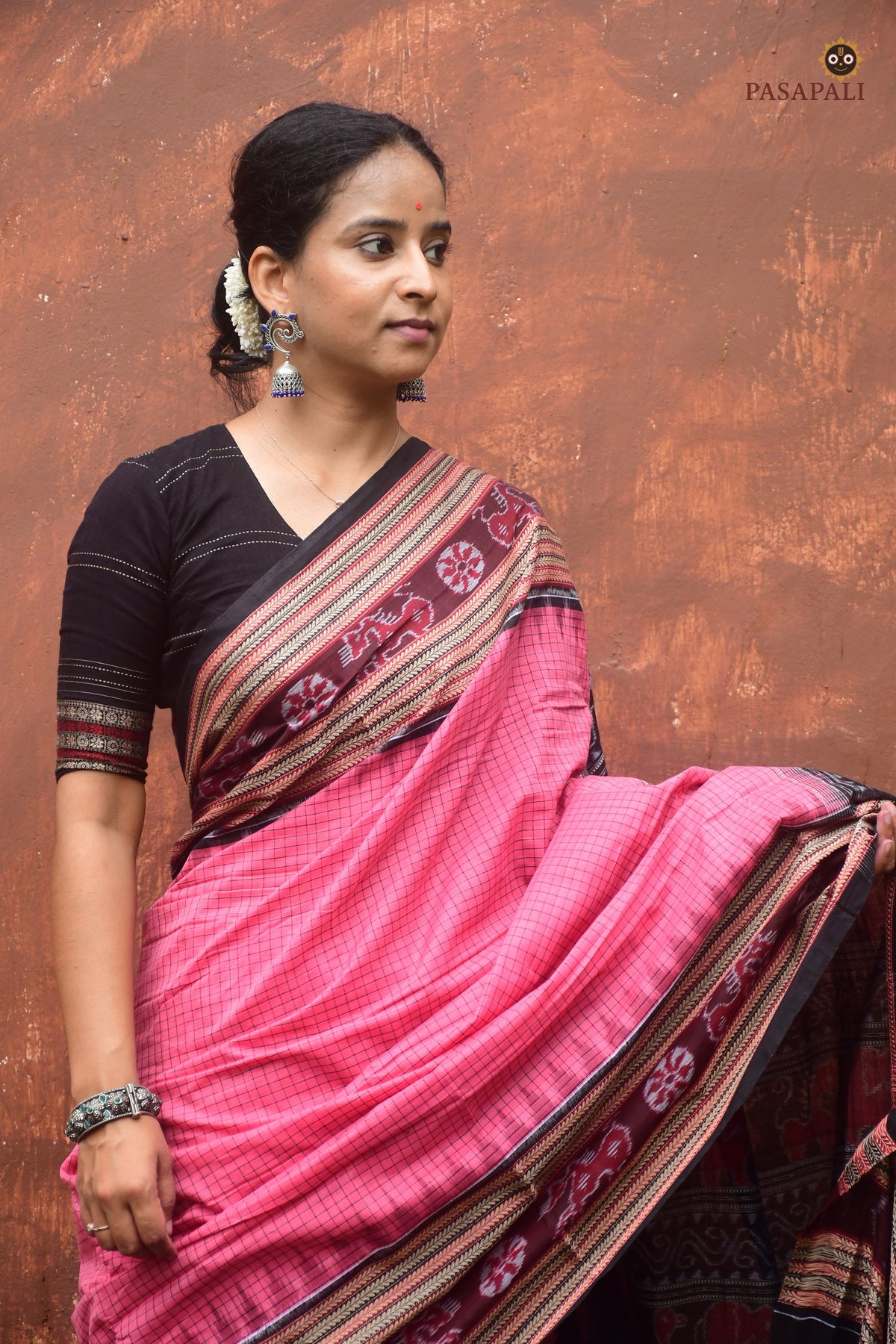 Handloom drape view of Sharada — pink Sambalpuri Bandha saree with sachipar checks and khajur border by Pasapali