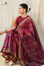 Load image into Gallery viewer, Flat lay of Shri Goddess Lakshmi Inspired maroon Sambalpuri Bandha mercerized cotton saree — Pasapali
