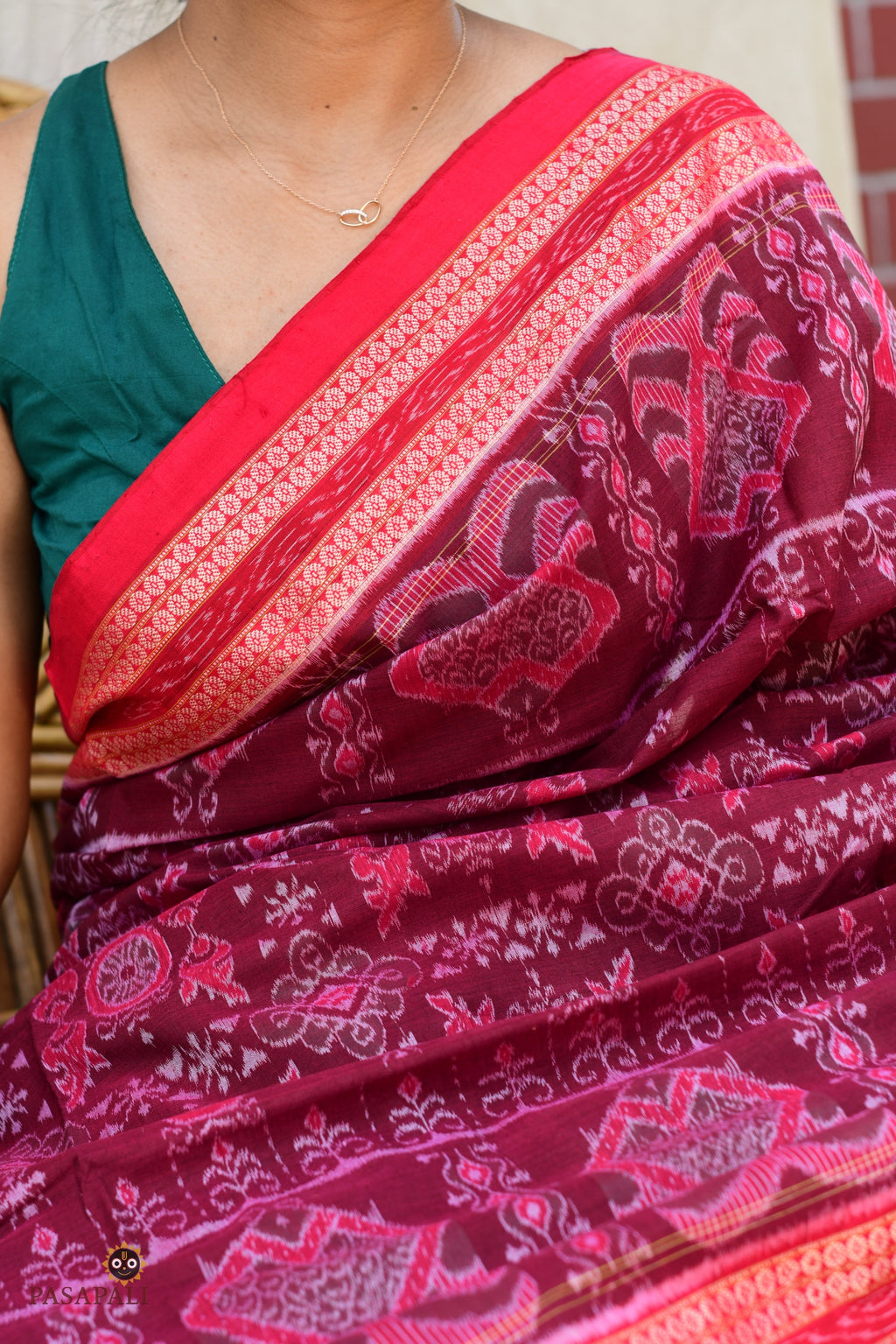 Shubhashree Sambalpuri Bandha mercerized cotton saree — drape detail showing red secondary colour and jhoti motif