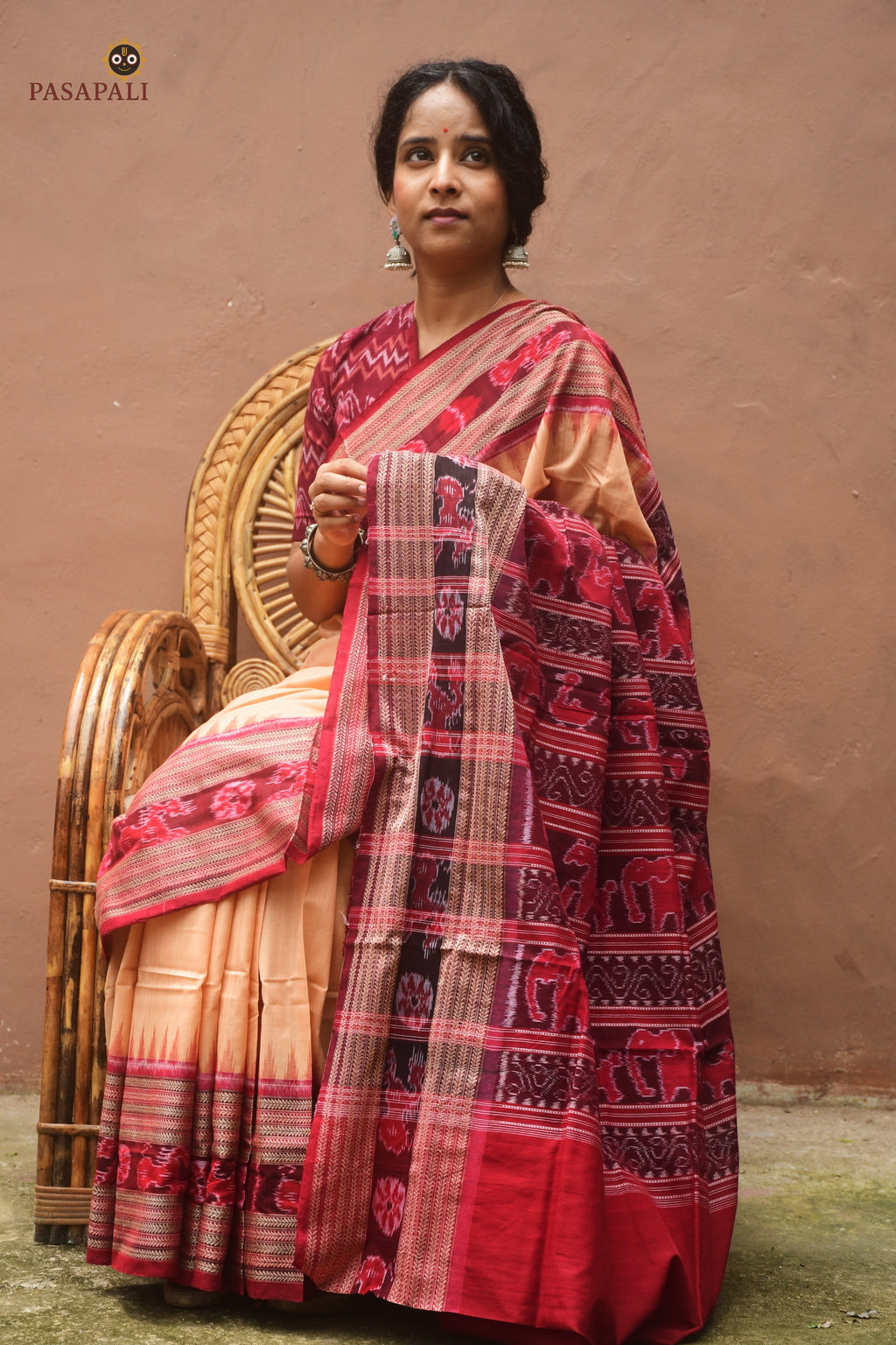 Ikat motif detail on Sunanda Sambalpuri saree — resist-dyed deer and elephant patterns woven by Bhulia weavers