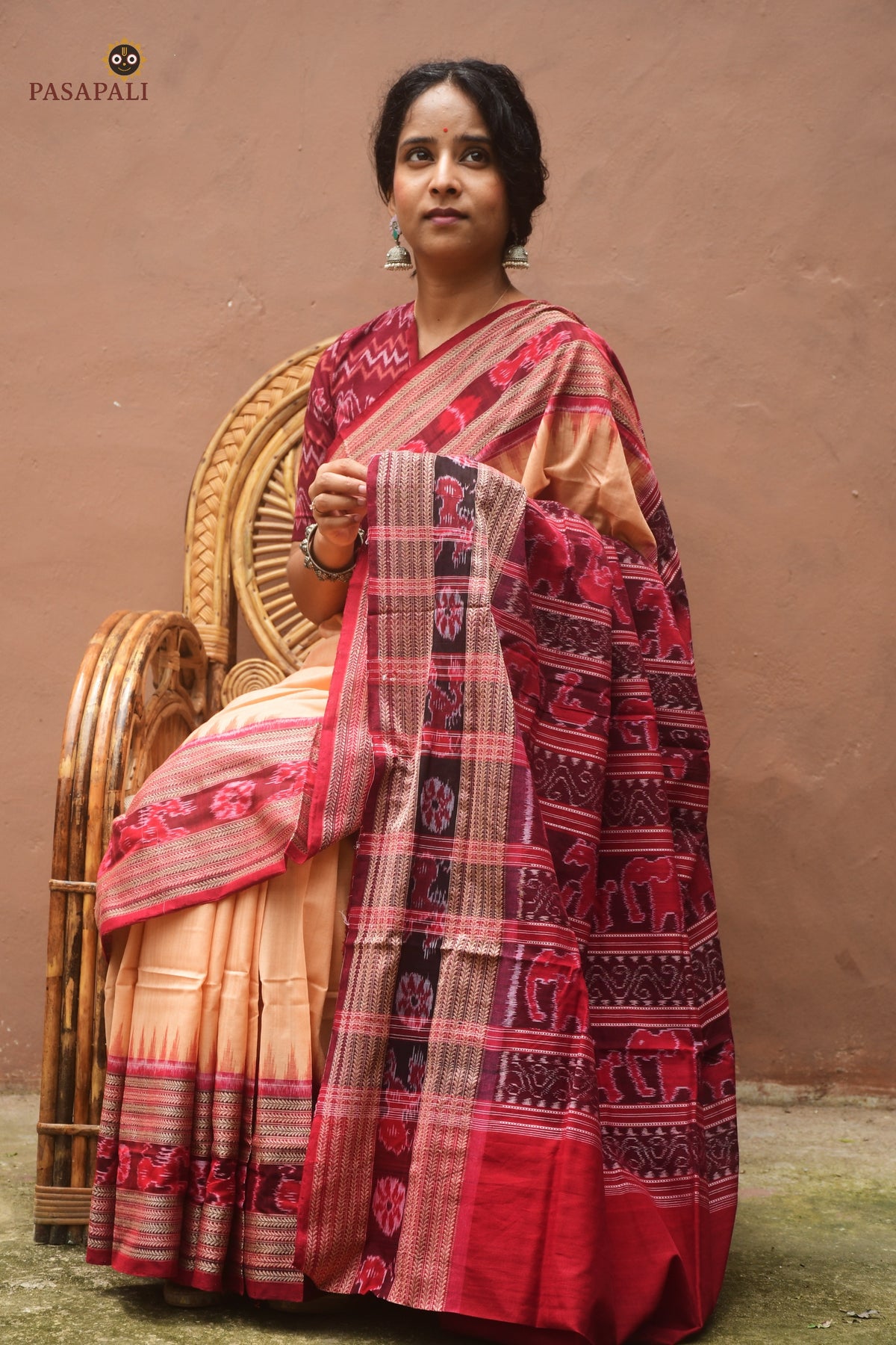 Ikat motif detail on Sunanda Sambalpuri saree — resist-dyed deer and elephant patterns woven by Bhulia weavers