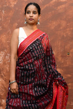 Load image into Gallery viewer, Tilottama Black Sambalpuri Bandha mercerized cotton saree full view — flower buta, fish motifs, red ikat pallu by Pasapali
