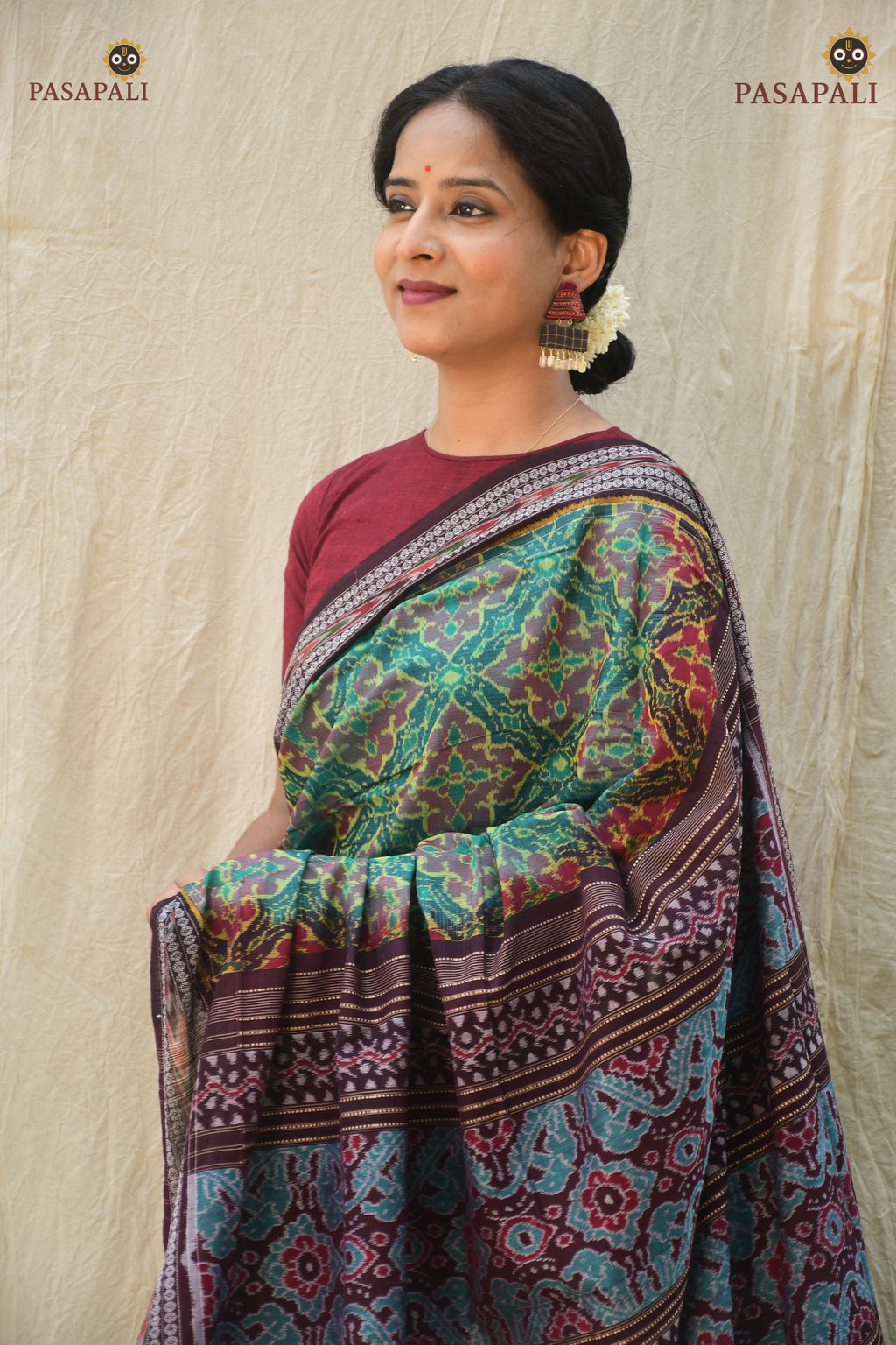 Vanalata green mercerized cotton Sambalpuri Bandha saree — front drape showing Plula body motif, Pasapali