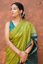 Load image into Gallery viewer, Vanasri Sambalpuri Bandha cotton saree — front drape view showing plain solid green body and dark green border detail by Pasapali
