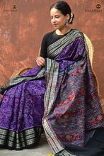 Load image into Gallery viewer, Flat lay of Vasundhara — full purple Sambalpuri Bandha mercerized cotton saree with fish border and phula lata pallu.
