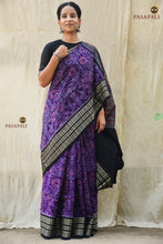Load image into Gallery viewer, Vasundhara purple Sambalpuri Bandha mercerized cotton saree — full hero view, fish border and black phula lata pallu. Pasapali.

