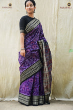 Load image into Gallery viewer, Front drape of Vasundhara — purple Sambalpuri double ikat cotton saree with traditional flower motifs across the body. Pasapali.
