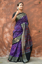 Load image into Gallery viewer, Close-up of fish motif border on Vasundhara, a GI certified Sambalpuri Bandha mercerized cotton saree in purple. Pasapali.
