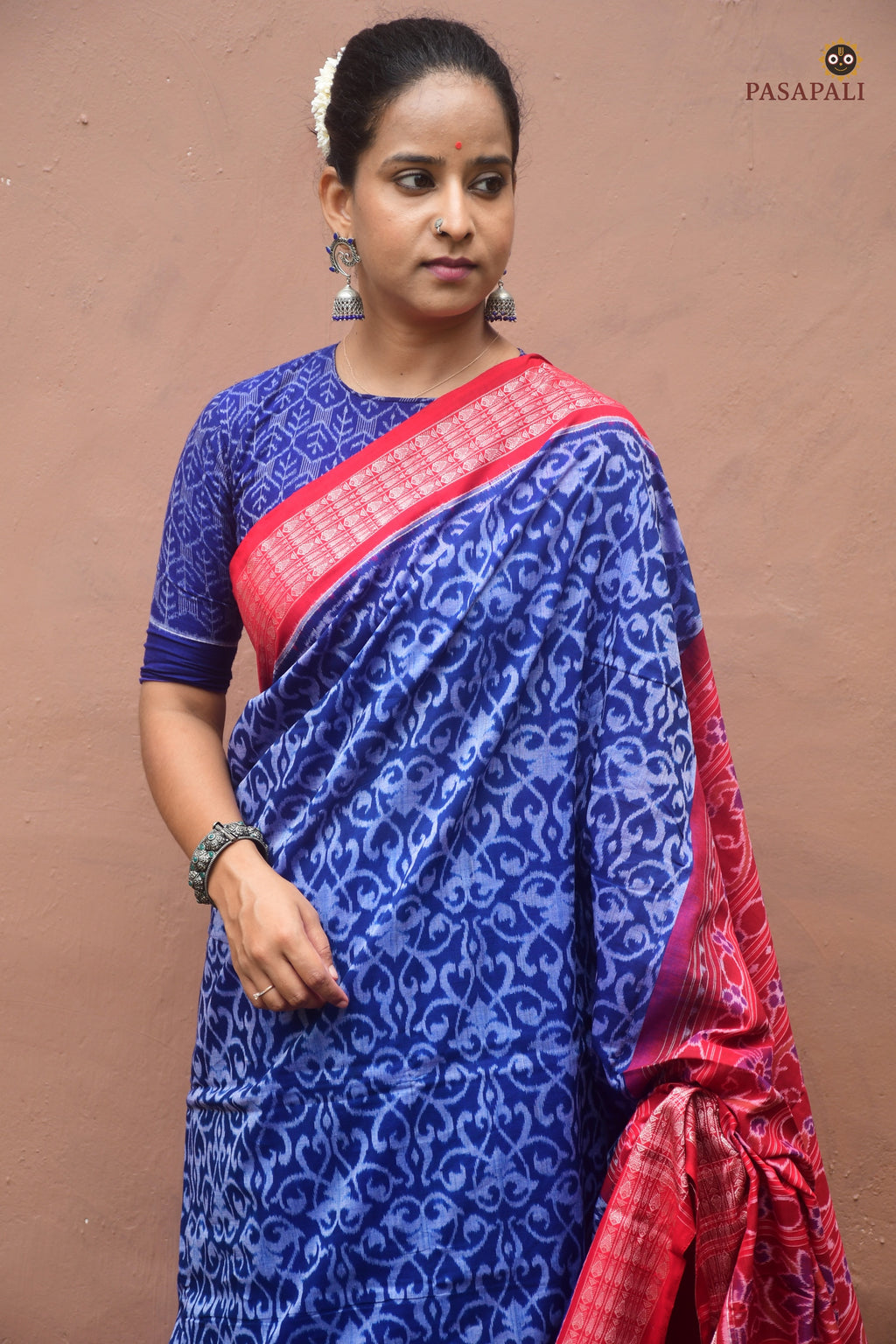 Yashodhara Blue Sambalpuri cotton saree front drape — Bandha ikat weave, red accents, fish border by Pasapali